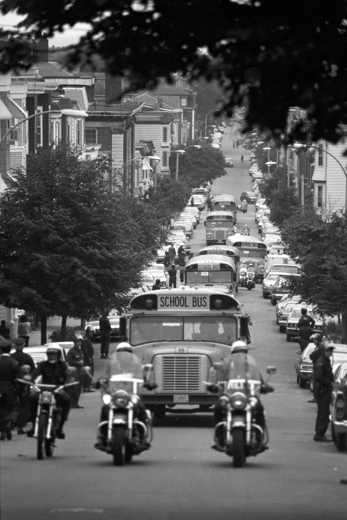 Buses escorted by police cars