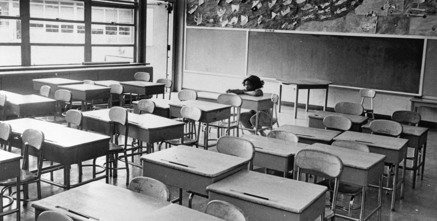 Girl alone in classroom